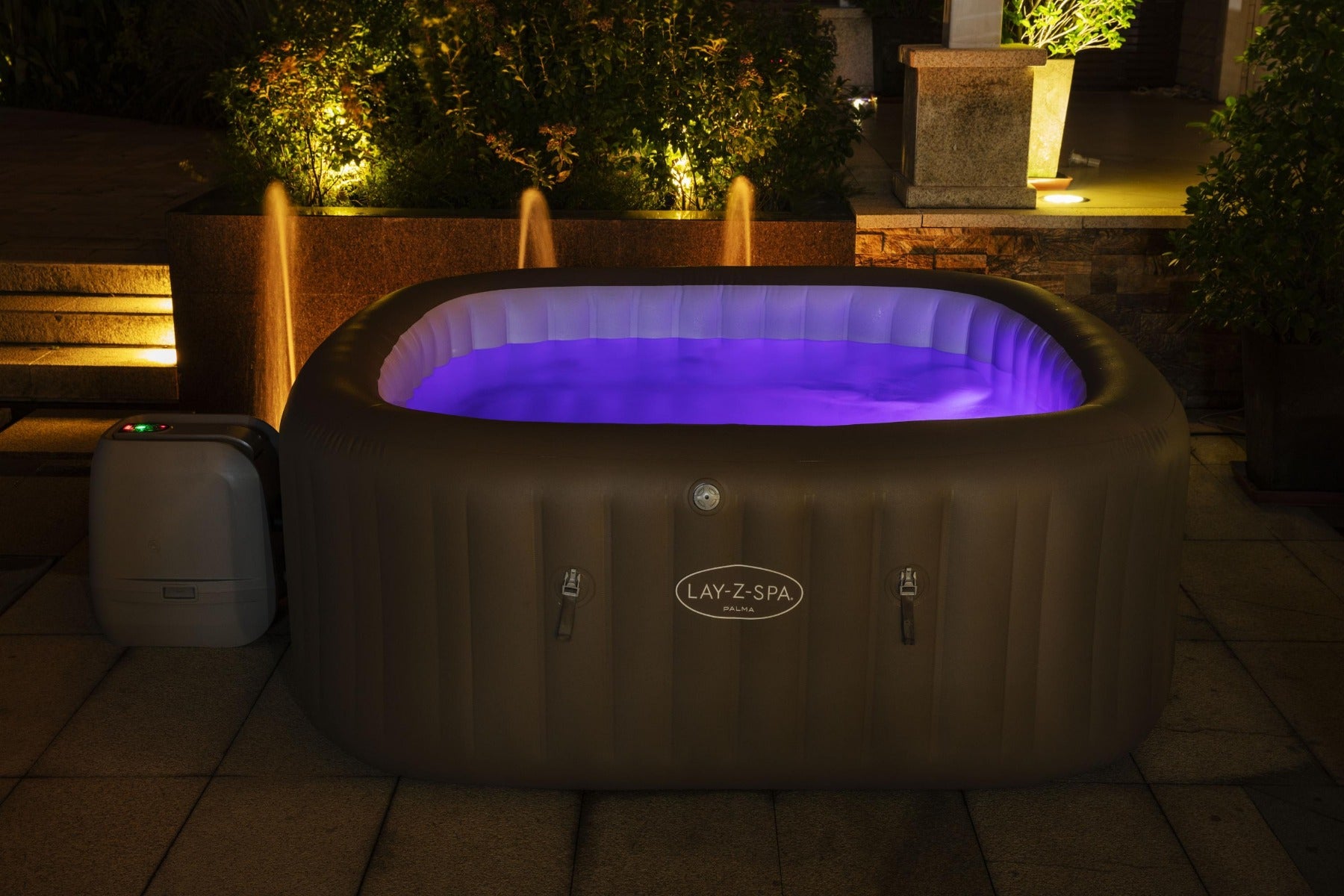 Inflatable Palma Hydrojet Pro Hot Tub with glowing blue LED lights, featuring comfortable seats for relaxation