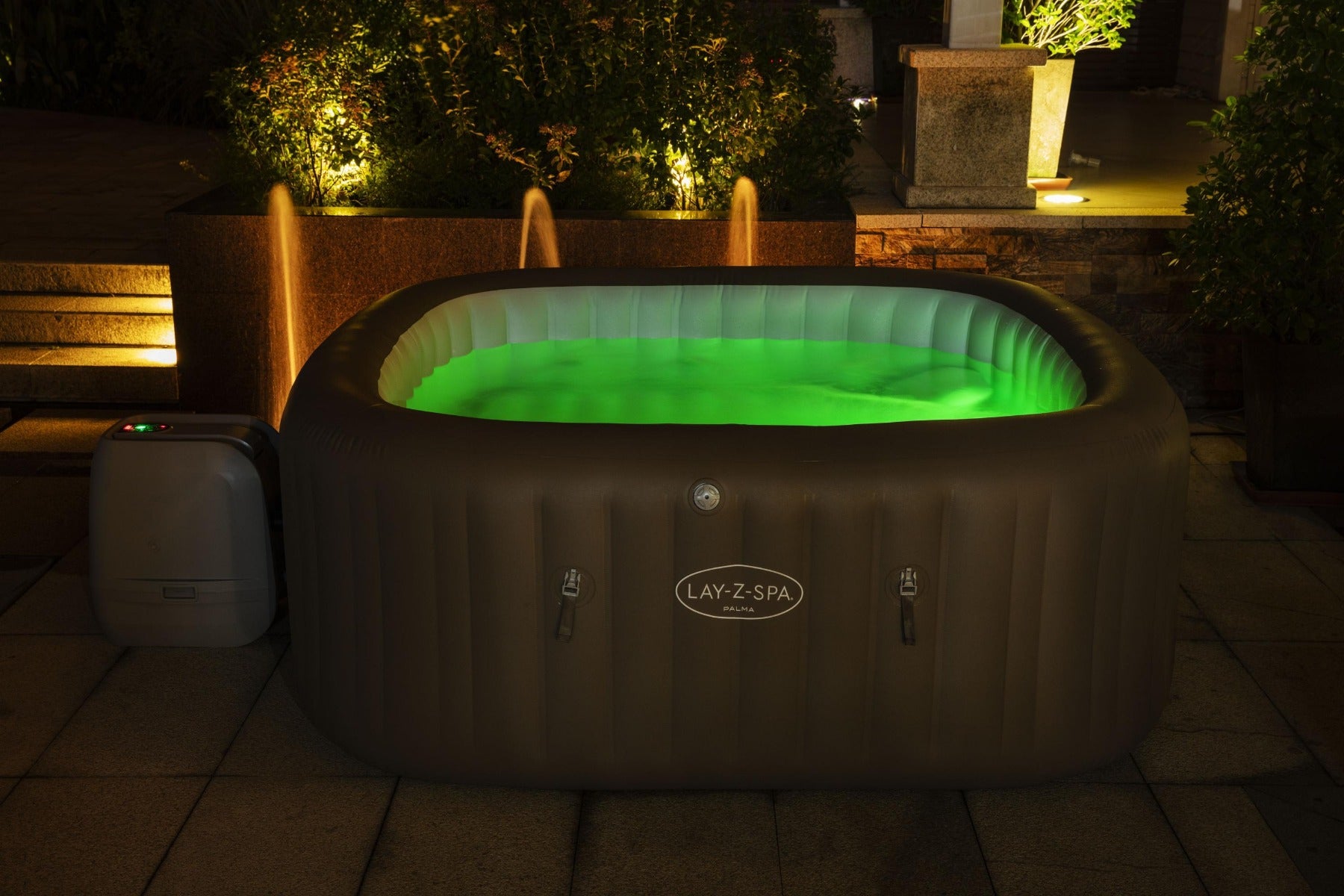 Inflatable Palma Hydrojet Pro Hot Tub with glowing green LED lights, featuring comfortable seats for relaxation