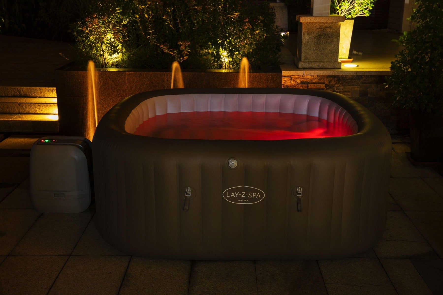 Inflatable Palma Hydrojet Pro Hot Tub with glowing red LED lights, featuring comfortable seats for relaxation