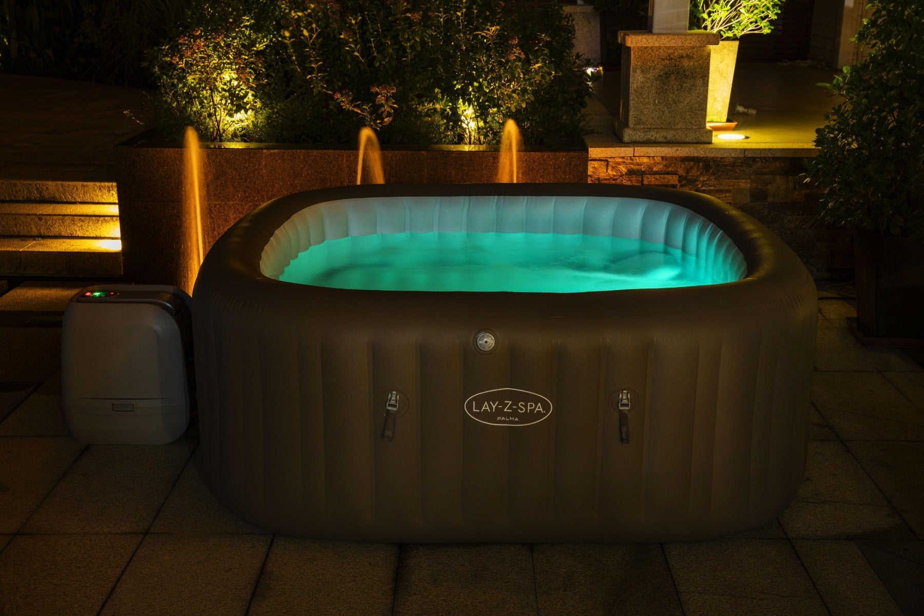 Inflatable Palma Hydrojet Pro Hot Tub with glowing white LED lights, featuring comfortable seats for relaxation